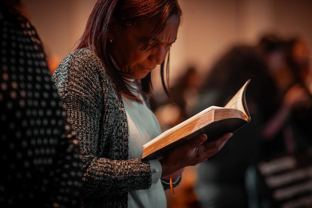 Lady reading the bible.